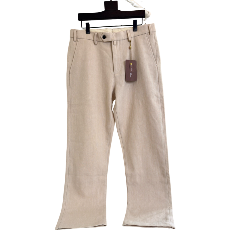 Pantalon en lin beige coupe large avec étiquette de marque
